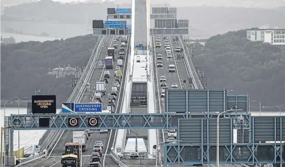  ?? Picture: Getty. ?? Commuters using the new Queensferr­y Crossing have suffered from delays since it opened to the public on August 30.