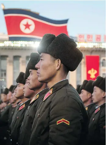  ?? KIM WON-JIN/AFP/GETTY IMAGES ?? North Korean soldiers attend a mass rally on Friday in Pyongyang to celebrate the country’s declaratio­n two days earlier that it had achieved full nuclear statehood. North Korea tested an ICBM on Wednesday.