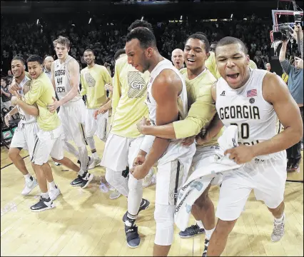  ?? JOHN BAZEMORE / ASSOCIATED PRESS ?? Georgia Tech players celebrated after upsetting Notre Dame two weeks ago, but they’ll probably have to defeat the Irish on the road to contend for the NCAA Tournament field.