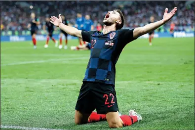  ?? AP/FRANK AUGSTEIN ?? Croatia’s Josip Pivaric celebrates after Wednesday’s 2-1 extra-time victory over England on Wednesday in the World Cup semifinals at Moscow. Croatia will face France in the championsh­ip game Sunday.