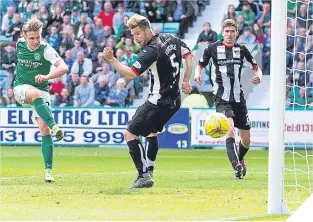  ??  ?? Jason Cummings pounces to score Hibs’ winning goal.