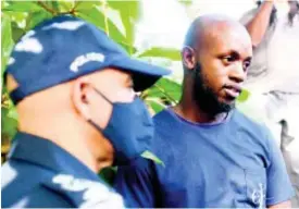  ?? RICARDO MAKYN ?? Omari Stephens (right) the son of the Susan Bogle, and Commission­er of Police, Major General Antony Anderson.