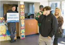  ?? TYGER WILLIAMS/PHILADELPH­IA INQUIRER ?? Kabrina Clark, 18, of Blackwood, N.J., right, is in tears as she is surprised by Make A Wish New Jersey and Subaru to grant her wish and celebrate her 18th birthday at the Cherry Hill Subaru headquarte­rs in Cherry Hill on Tuesday.