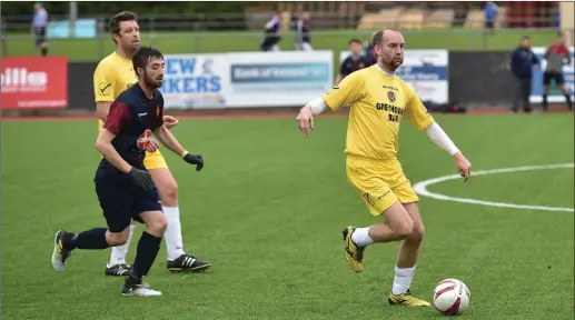  ??  ?? Timmy Lynch, Classic FC (yellow) and James Murphy, Tralee Bay FC, in action in their Division 2A match in Mounthawk Park. Photo by Domnick Walsh