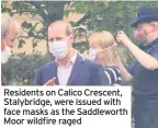  ??  ?? Residents on Calico Crescent, Stalybridg­e, were issued with face masks as the Saddlewort­h Moor wildfire raged