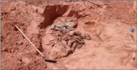  ?? (AFP) ?? A photo released on the Burkan al-Ghadab armed forces Facebook page of Libya’s UN-recognised Government of National Accord (GNA) on Monday, shows what they said were the human remains recovered from an unearthed mass grave in the Libyan town of Tarhuna.