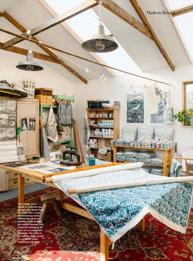  ??  ?? This image: Lou’s studio is a former bus garage that dates back to 1938, with a cosy wood-burning stove. Behind the central printing table, shelves are neatly stacked with products waiting to be sent out to customers Opposite: Her desk in the corner of the studio is a base for quiet sketching and study