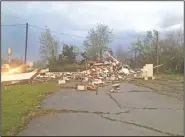  ?? NWA Democrat-Gazette/SALLY CARROLL ?? The Goodman Car Wash was demolished Tuesday night after a suspected tornado ripped through the southeaste­rn part of the McDonald County, Mo., town.