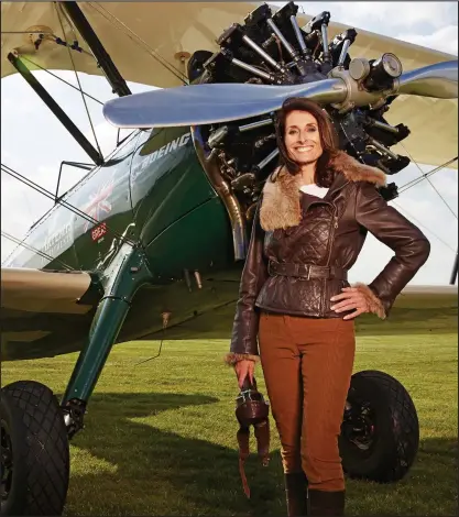  ??  ?? Adventurer: Tracey Curtis-Taylor with her biplane Spirit of Artemis. She plans to fly solo to Australia