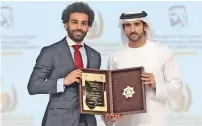  ?? Photo by Dhes Handumon ?? sheikh hamdan honours Mohamed salah. —