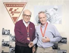  ??  ?? LEGEND. Kork Ballington receives his MotoGP Legend accolade from Carlos Ezpeleta, chief executive of Dorna Sports.