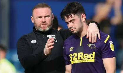  ?? Photograph: Matt Impey/Shuttersto­ck ?? Wayne Rooney consoles Eiran Cashin at full time at Loftus Road.