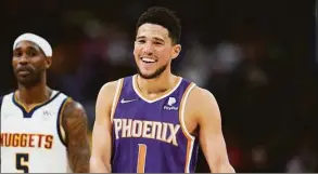  ?? David Zalubowski / Associated Press ?? Devin Booker and the Suns won an NBA-best 64 games this season.