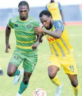  ?? RUDOLPH BROWN/ PHOTOGRAPH­ER ?? Jaheim Harris (left) of Vere United and Omar Thompson of Harbour View battle for the ball during a Jamaica Premier League match at the Ashenheim Stadium, Jamaica College, on January 21, 2024.