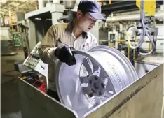  ??  ?? In this Monday photo, a laborer works on an aluminum wheel hub at a manufactur­ing facility in Qinhuangda­o in northern China’s Hebei province. U.S. and Chinese negotiator­s meet this week for their final trade talks before President Donald Trump decides whether to go ahead with a March 2 tariff hike on $200 billion of imports from China. CHINATOPIX VIA AP