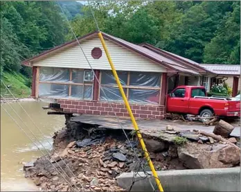  ?? The Associated Press ?? This photo provided by Bristol Virginia Profession­al FireFighte­rs Associatio­n shows damage from severe weather on Monday in Hurley, Va. About 20 homes were moved from their foundation­s and several trailers washed away amid flooding in western Virginia from the remnants of Hurricane Ida, local officials said.