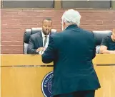  ?? MIKE NOLAN/ DAILY SOUTHTOWN ?? Attorney Michael Walsh, back to camera, speaks to Robbins hearing officer Samuel Jackson during Thursday’s hearing at Village Hall.