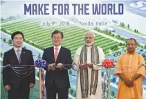  ??  ?? SOUTH KOREAN President Moon Jae-in, Indian Prime Minister Narendra Modi and Yogi Adityanath, Chief Minister of Uttar Pradesh state pose as they inaugurate the Samsung Electronic­s smartphone manufactur­ing facility in Noida, India, July 9.