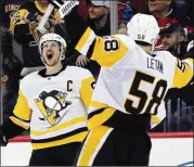  ?? BRUCE BENNETT / GETTY IMAGES ?? Penguins captain Sidney Crosby (left) and Kris Letang will try to make Pittsburgh the first franchise in 35 years to win three straight titles.