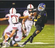  ?? Christian Abraham / Hearst Connecticu­t Media ?? Harding’s Coleman Adams, right, tries to break away from a Foran player during Friday’s game in Bridgeport.