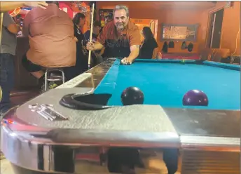  ?? SOL TRAVERSO/Taos News ?? Brian Aragon tries his third attempt to pocket the 8-ball. Aragon was the winner of the tournament.