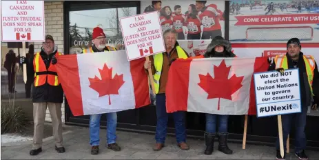  ??  ?? Yellow vest protesters show their opposition to the Trudeau government and the United Nations Global Compact for Migration during a rally at Swift Current City Hall, Dec. 29.