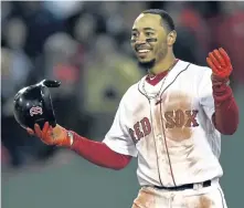  ?? STAFF PHOTO BY CHRISTOPHE­R EVANS ?? WHAT’S THE PLAN? Mookie Betts reacts after stealing second base in the first inning of Game 1 last night, but manager Alex Cora doesn’t expect Betts to play second base during the World Series.