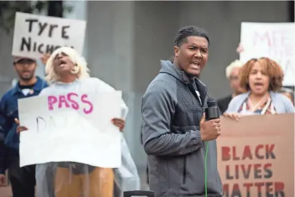  ?? PHOTOS BY CHRIS DAY/THE COMMERCIAL APPEAL ?? Ron Davis, an organizer with Stand for Children and Memphis Interfaith Coalition for Action and Hope, leads a chant during a rally outside Memphis City Hall on Thursday.