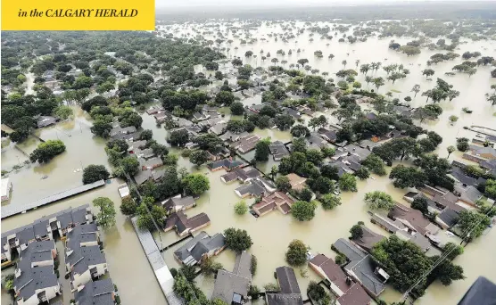  ?? DAVID J. PHILLIP / THE ASSOCIATED PRESS ?? Neighbourh­oods in Houston sit underwater as a record-breaking 125 centimetre­s of rain fell from Tropical Storm Harvey as of early Tuesday.