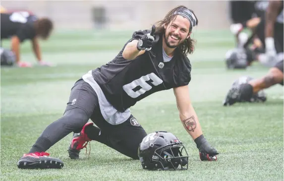  ?? WAYNE CUDDINGTON ?? Antoine Pruneau stretches as the Redblacks practise at TD Place before they hit the road for their next matchup in Edmonton on Friday night.