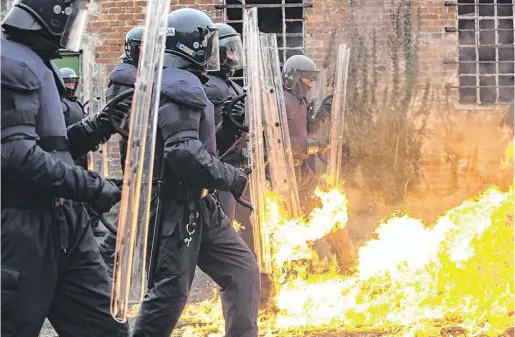  ??  ?? Thin blue line: Members of An Garda Síochána riot squad take part in a training exercise at Gormanston Army Camp, Co Meath.