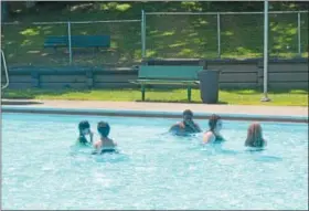  ?? NICHOLAS BUONANNO-NBUONANNO@TROYRECORD.COM ?? Youth hang out while swimming in Lansing Pool in Cohoes Monday afternoon.