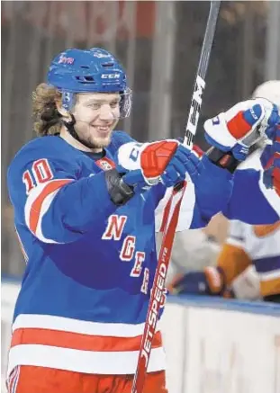  ??  ?? Artemi Panarin celebrates his second goal in Monday night’s victory over Isles.