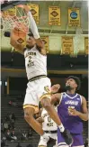  ?? ?? Southern Mississipp­i forward Victor Hart dunks in the second half of the Golden Eagles’ victory over No. 19 James Madison in Hattiesbur­g, Miss.