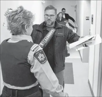  ?? CP PHOTO ?? A member of the media is checked with a security wand before entering the room to view Paul Bernardo’s parole hearing at Millhaven Institutio­n in Bath, Ont., on Wednesday.