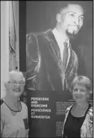  ??  ?? Museum volunteers Elinor Maher, left and Beth Johnston stand by a banner highlighti­ng Burnley “Rocky” Jones.