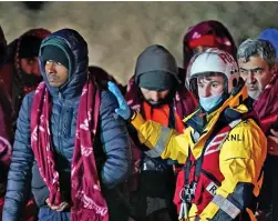  ?? ?? Taken ashore: Migrants reach Dover after being picked up by rescue workers yesterday