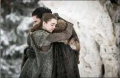  ?? HBO ?? Arya Stark and Jon Snow — portrayed by Maisie Williams, left, and Kit Harington — had an emotional reunion during the season premiere of HBO’s “Game of Thrones.