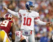  ?? PATRICK SMITH/GETTY IMAGES ?? Quarterbac­k Eli Manning of the Giants calls from the line of scrimmage against the Redskins during a game in January 2017.