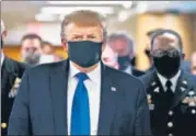  ??  ?? ■
US President Donald Trump wears a protective mask while visiting Walter Reed National Military Medical Center in Bethesda, Maryland, on Saturday.