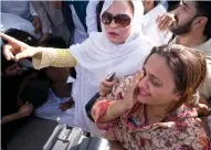  ??  ?? Supporters of Nawaz Sharif react outside a court following a ruling against him, in Islamabad on Friday. — AP