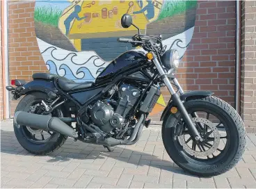  ?? NEIL VORANO / DRIVING. CA ?? Honda’s 2017 Rebel ABS looks include a blackout engine and low, wide seat.