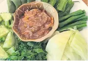  ??  ?? These local dishes are served in Ban Suwimon restaurant on Wian Kaphang Road. The restaurant has four out of five dishes that are certified as authentic southern food by the Tourism Authority of Thailand. The specialiti­es are namphrikku­ngsiab (spicy...