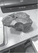  ?? PROVIDED BY PORT OF CORPUS CHRISTI POLICE DEPARTMENT ?? A large piece of industrial metal from the crane incident, found in a parking lot south of Whataburge­r Field, rests on a table at the Port of Corpus Christi Command Center.