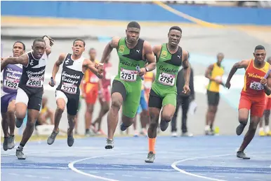  ?? FILE ?? Wolmer’s Boys School, Calabar High, Jamaica College and Kingston College complete their final baton changes in the Class 2 boys’ 4x100m at the Gibson McCook Relays at the National Stadium in Kingston on February 24, 2017.