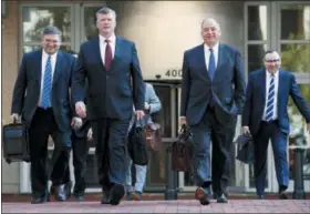  ?? JACQUELYN MARTIN — THE ASSOCIATED PRESS ?? The defense team for Paul Manafort, including Kevin Downing, front left, and Thomas Zehnle, front right, arrive at federal court for the continuati­on of the trial of the former Trump campaign chairman, in Alexandria, Va., Wednesday.