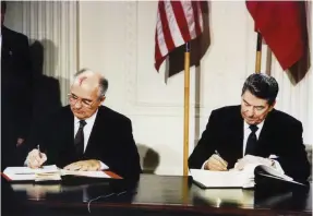  ?? (Reuters) ?? US PRESIDENT Ronald Reagan and former Soviet leader Mikhail Gorbachev sign the Intermedia­te-Range Nuclear Forces treaty in the White House in December 8, 1987.