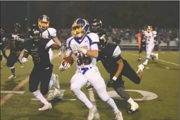  ?? The Sentinel-Record/Mara Kuhn ?? ROOM TO RUN: Lakeside running back Michael James (39) evades Hot Springs defenders Leotis McClure (6) and Satiair Thomas (1) during Friday’s game at Reese Memorial Stadium. James ran for 127 yards and two touchdowns in Lakeside’s 42-14 win.