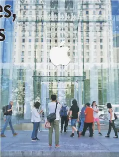  ??  ?? This file photo taken on Sept 14, 2016 shows the Apple logo at the entrance to the Fifth Avenue Apple store in New York. Apple on Jan 31, reported that its profit for the past quarter slipped 2.6 per cent to US$17.9 billion even as iPhone sales jumped...
