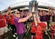  ?? ?? DREAM Keith Earls lifts trophy with his kids yesterday